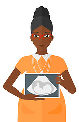 Image showing Pregnant woman with ultrasound image.