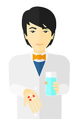 Image showing Pharmacist giving pills.