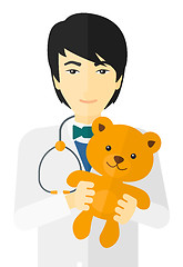 Image showing Pediatrician holding teddy bear.