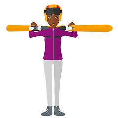 Image showing Woman holding skis.