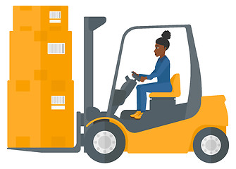 Image showing Worker moving load by forklift truck.