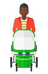 Image showing Man pushing pram.