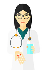 Image showing Pharmacist giving pills.