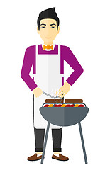 Image showing Man preparing barbecue.