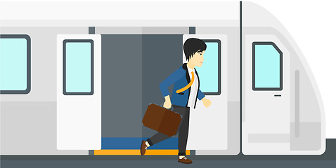 Image showing Man going out of train.