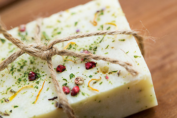 Image showing close up of handmade soap bars on wood