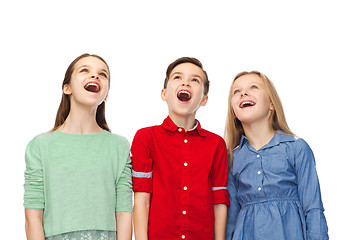 Image showing amazed boy and girls looking up