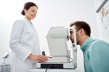 Image showing optician with tonometer and patient at eye clinic