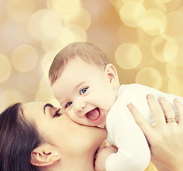 Image showing laughing baby playing with mother