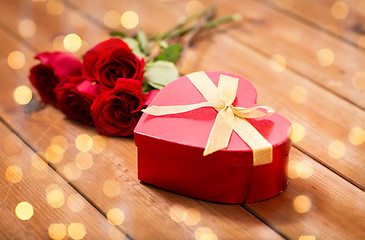 Image showing close up of heart shaped gift box and red roses