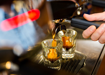 Image showing close up of woman doing espresso by coffee machine