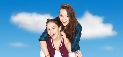 Image showing happy smiling pretty teenage girls hugging