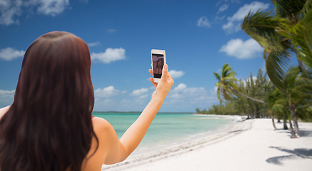 Image showing young woman taking selfie with smartphone