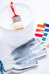 Image showing paintbrush, paint pot, gloves and pantone samples