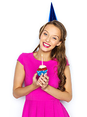 Image showing happy woman or teen girl with birthday cupcake