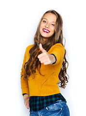 Image showing happy young woman or teen girl showing thumbs up