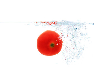 Image showing tomato falling or dipping in water with splash