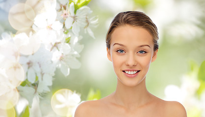 Image showing smiling young woman face and shoulders