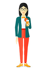 Image showing Woman holding glass of juice.