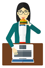 Image showing Woman eating hamburger. 