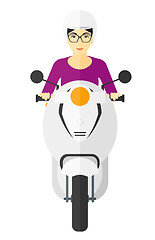 Image showing Woman riding scooter.