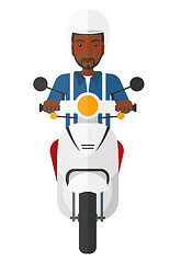 Image showing Man riding scooter.