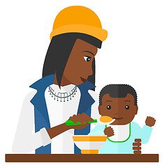 Image showing Woman feeding baby.