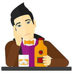 Image showing Sad man with bottle and glass.