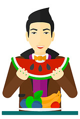 Image showing Man eating watermelon.