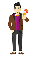 Image showing Man holding glass of juice.