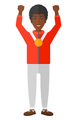 Image showing Athlete with medal and hands raised.