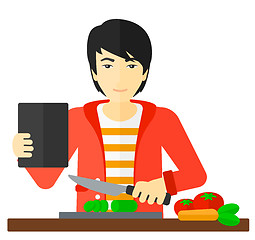 Image showing Man cooking meal.