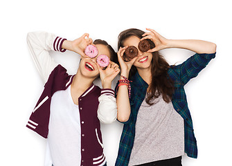 Image showing happy pretty teenage girls with donuts having fun