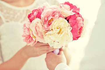 Image showing close up of happy lesbian couple with flowers