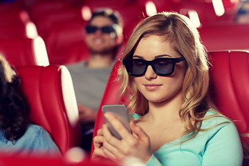 Image showing happy woman with smartphone in 3d movie theater