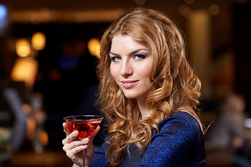 Image showing glamorous woman with cocktail at night club or bar