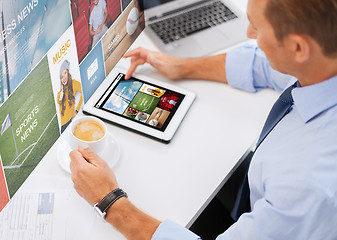 Image showing businessman with tablet pc and coffee in office