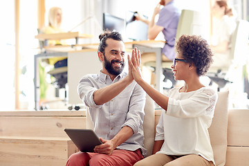 Image showing office workers with tablet pc making high five