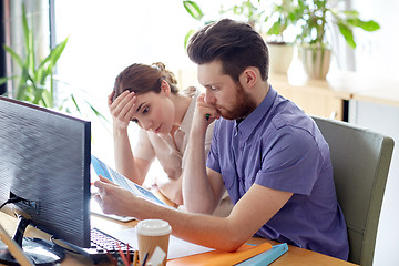 Image showing business team with computer and files in office