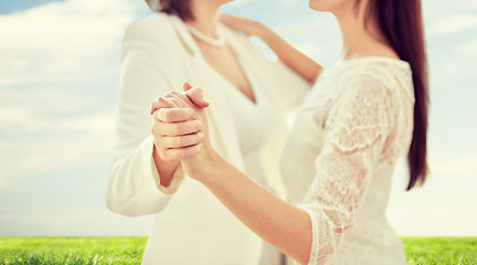 Image showing close up of happy married lesbian couple dancing