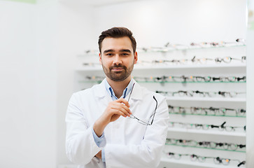 Image showing man optician with glasses in coat at optics store