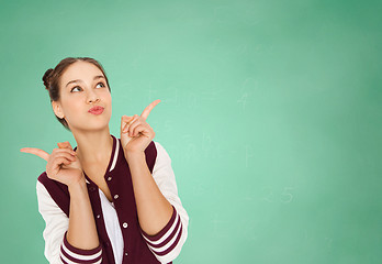 Image showing happy teenage student girl over green school board