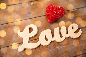 Image showing close up of word love with red heart decoration