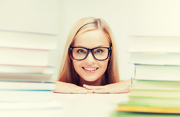 Image showing student with stack of books