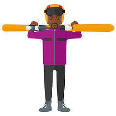 Image showing Man holding skis.