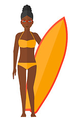 Image showing Surfer holding surfboard.