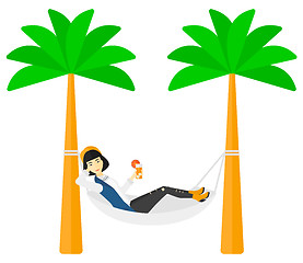 Image showing Woman chilling in hammock.