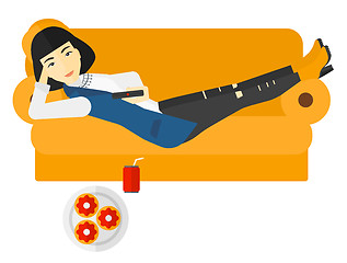 Image showing Woman lying on sofa with junk food.