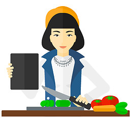 Image showing Woman cooking meal.