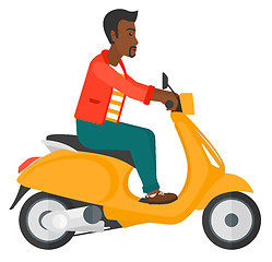 Image showing Man riding scooter.